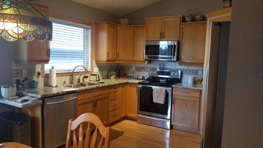 Orange oak kitchen before painting