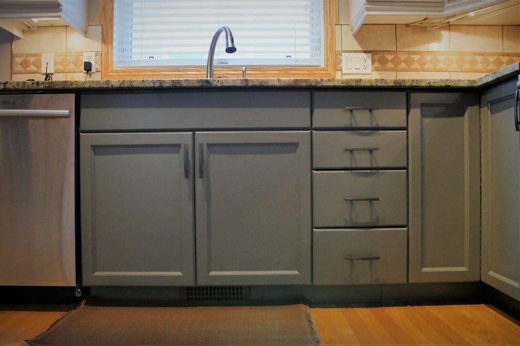 Earthy grey painted lower cabinetry
