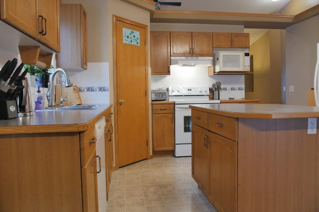 South Calgary yellow oak kitchen and island before painting