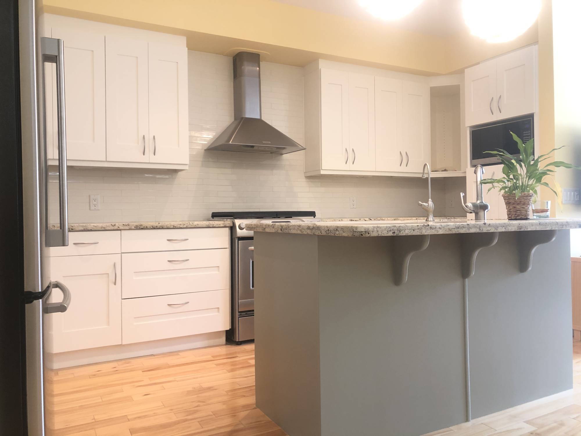 Modern two-tone white and grey island painted cabinets