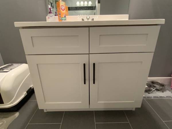 SE Calgary modern white painted bathroom vanity with black handles
