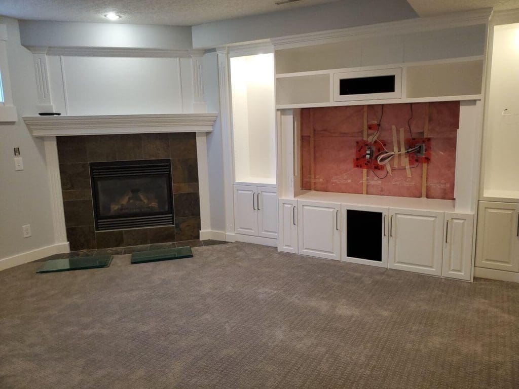 Basement TV stand and fireplace mantel painted modern white