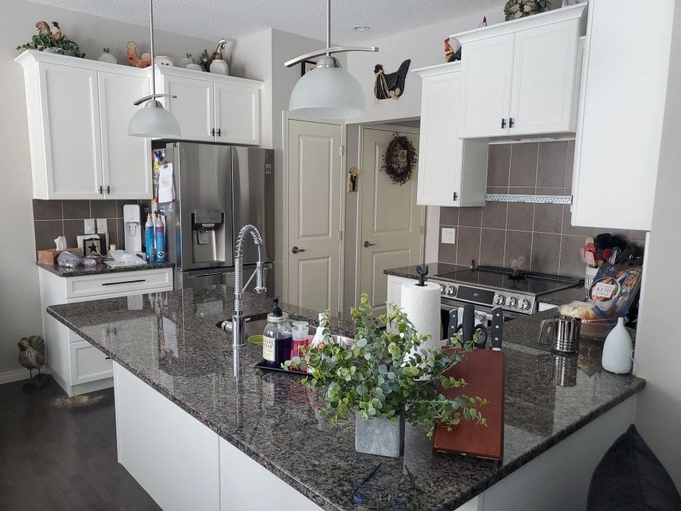 Dark Cabinets Repainted Off White after 1