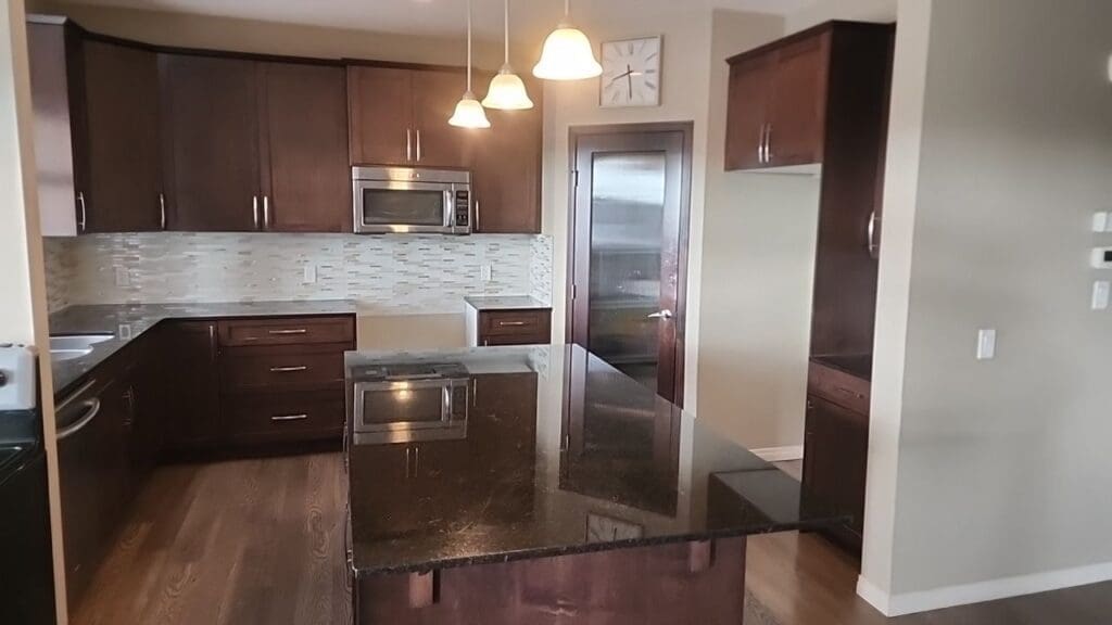 chocolate cabinets painted white before 3